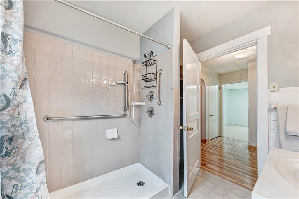 1299 Harvey Run Road Freedom, PA 15042 - Photo 12 of 25 a bathroom with a shower and a sink