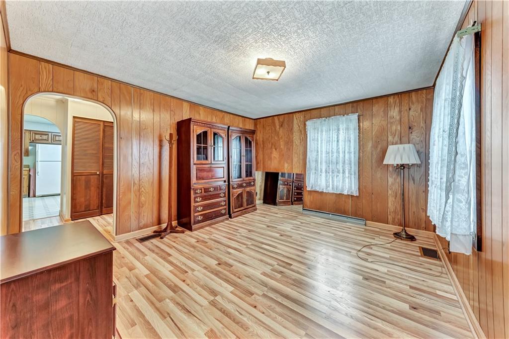 1299 Harvey Run Road Freedom, PA 15042 - Photo 14 of 25 a bedroom with a bed and large windows