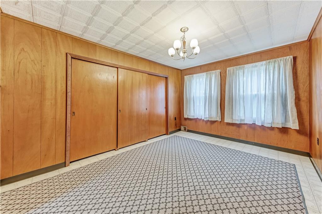 1299 Harvey Run Road Freedom, PA 15042 - Photo 15 of 25 a view of an empty room with a chandelier