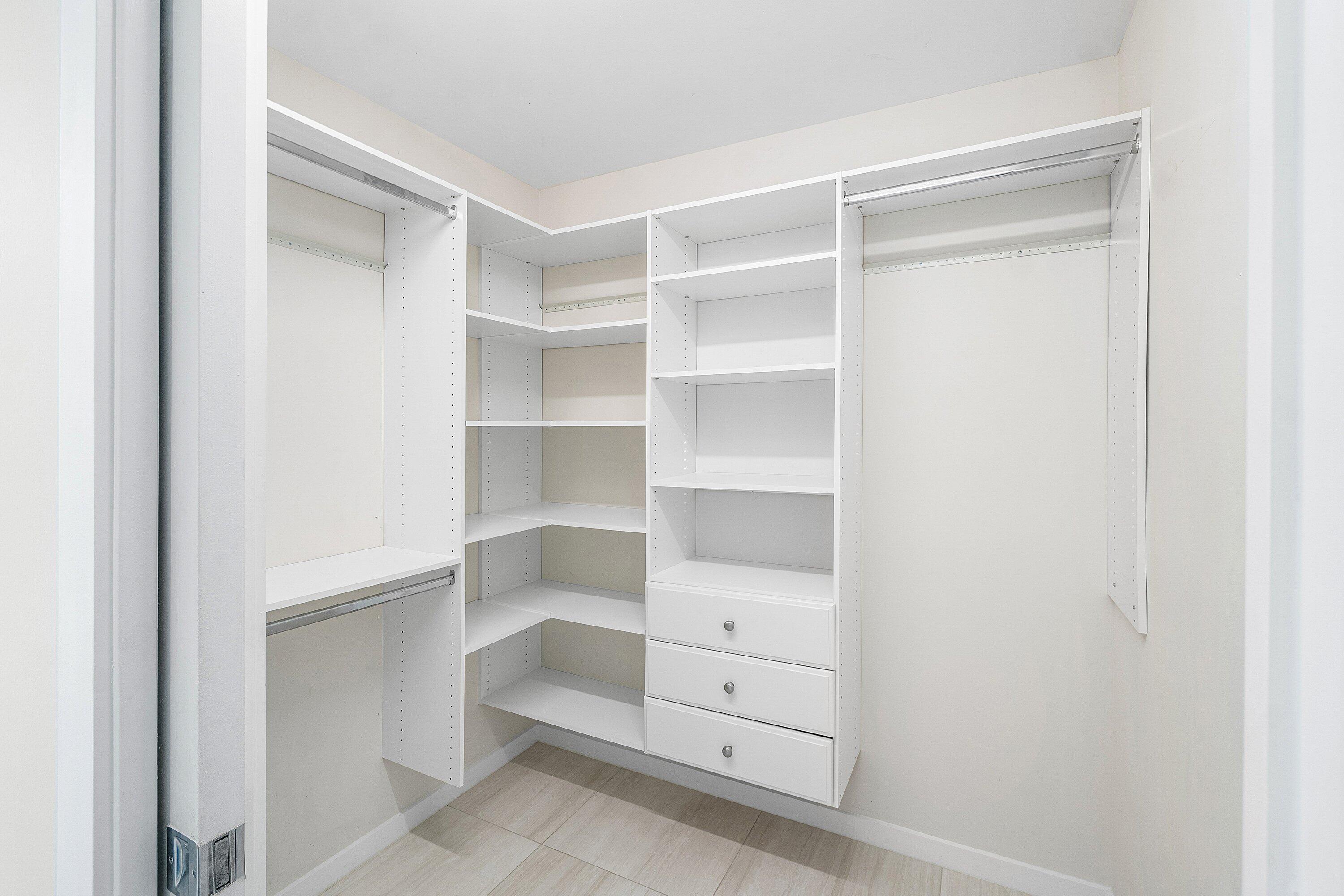 200 Southeast Mizner Boulevard, Unit 209 Boca Raton, FL 33432 - Photo 14 of 60 a view of an empty walk in closet