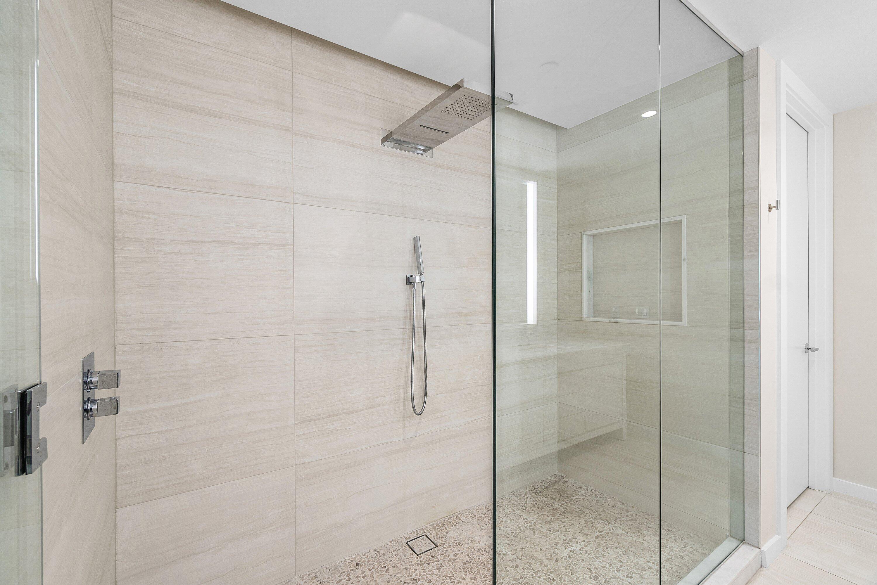 200 Southeast Mizner Boulevard, Unit 209 Boca Raton, FL 33432 - Photo 20 of 60 a bathroom with a shower and a glass door