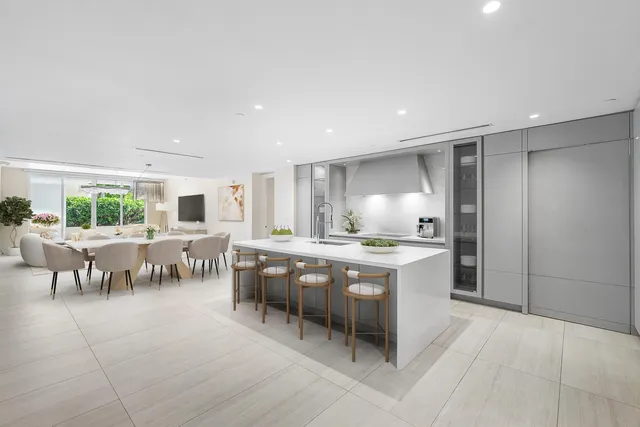 a kitchen with lots of counter top space and dining table
