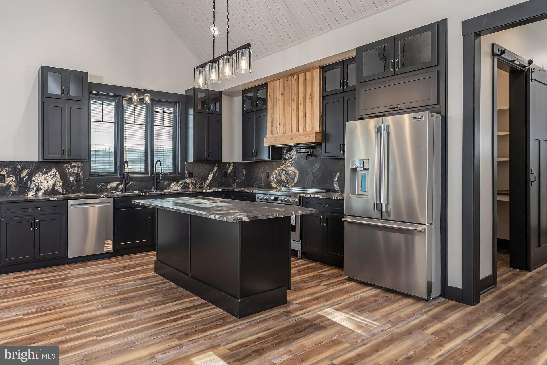 75 Ferrell Road Mullica Hill, NJ 08062 - Photo 13 of 42 a kitchen with a sink stove and refrigerator