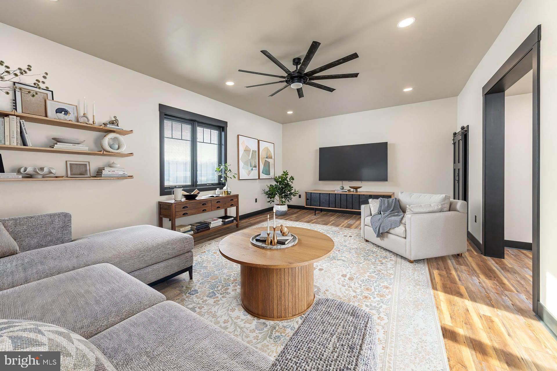 75 Ferrell Road Mullica Hill, NJ 08062 - Photo 18 of 42 a living room with furniture and a flat screen tv