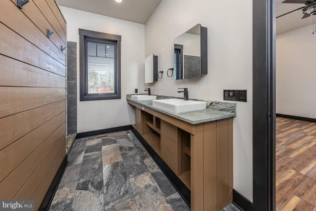 a en suite bathroom with a sink and a mirror