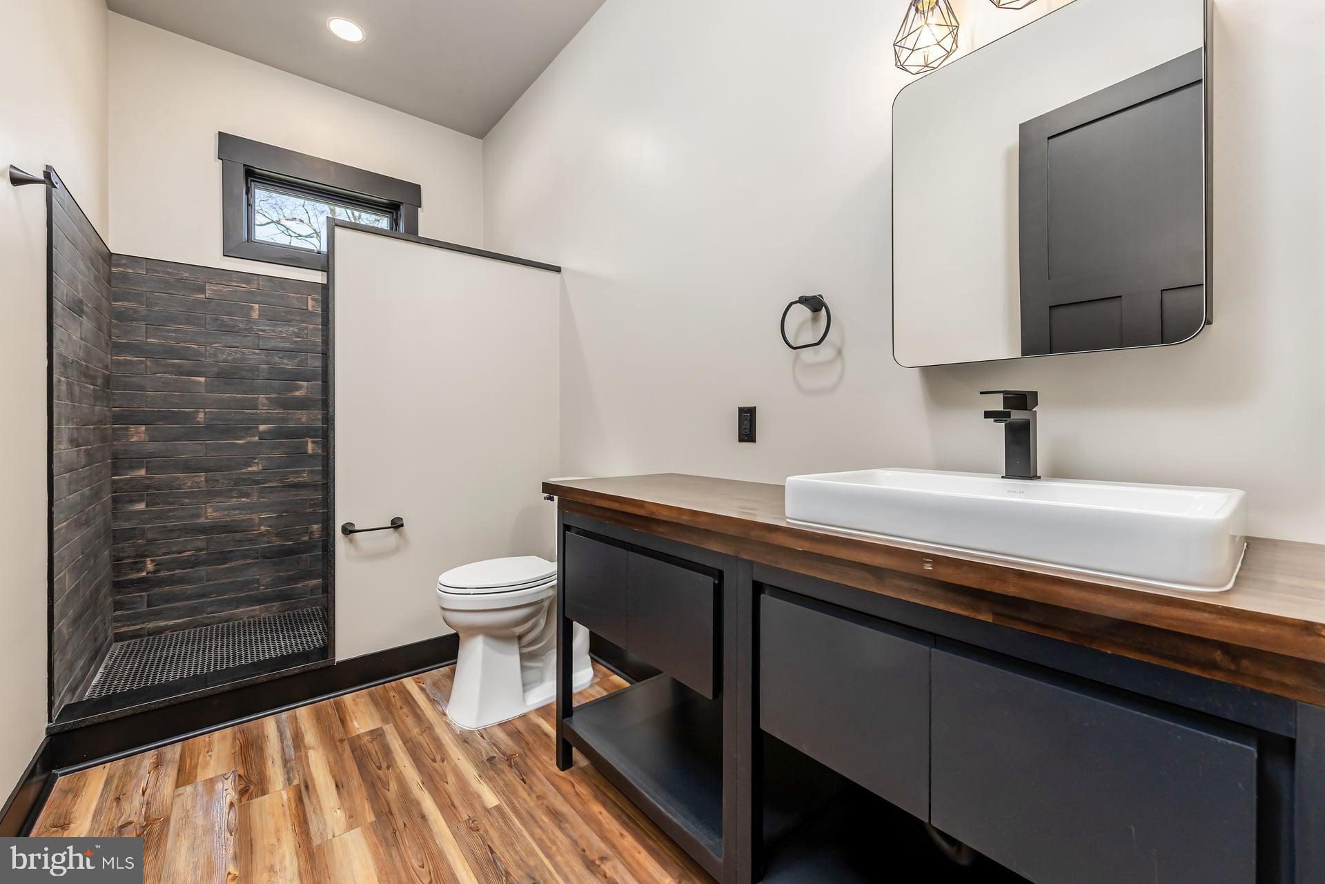 75 Ferrell Road Mullica Hill, NJ 08062 - Photo 27 of 42 a bathroom with a sink a toilet and mirror