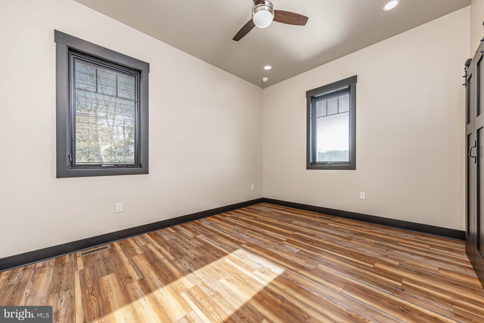 75 Ferrell Road Mullica Hill, NJ 08062 - Photo 28 of 42 a view of an empty room with wooden floor and a window