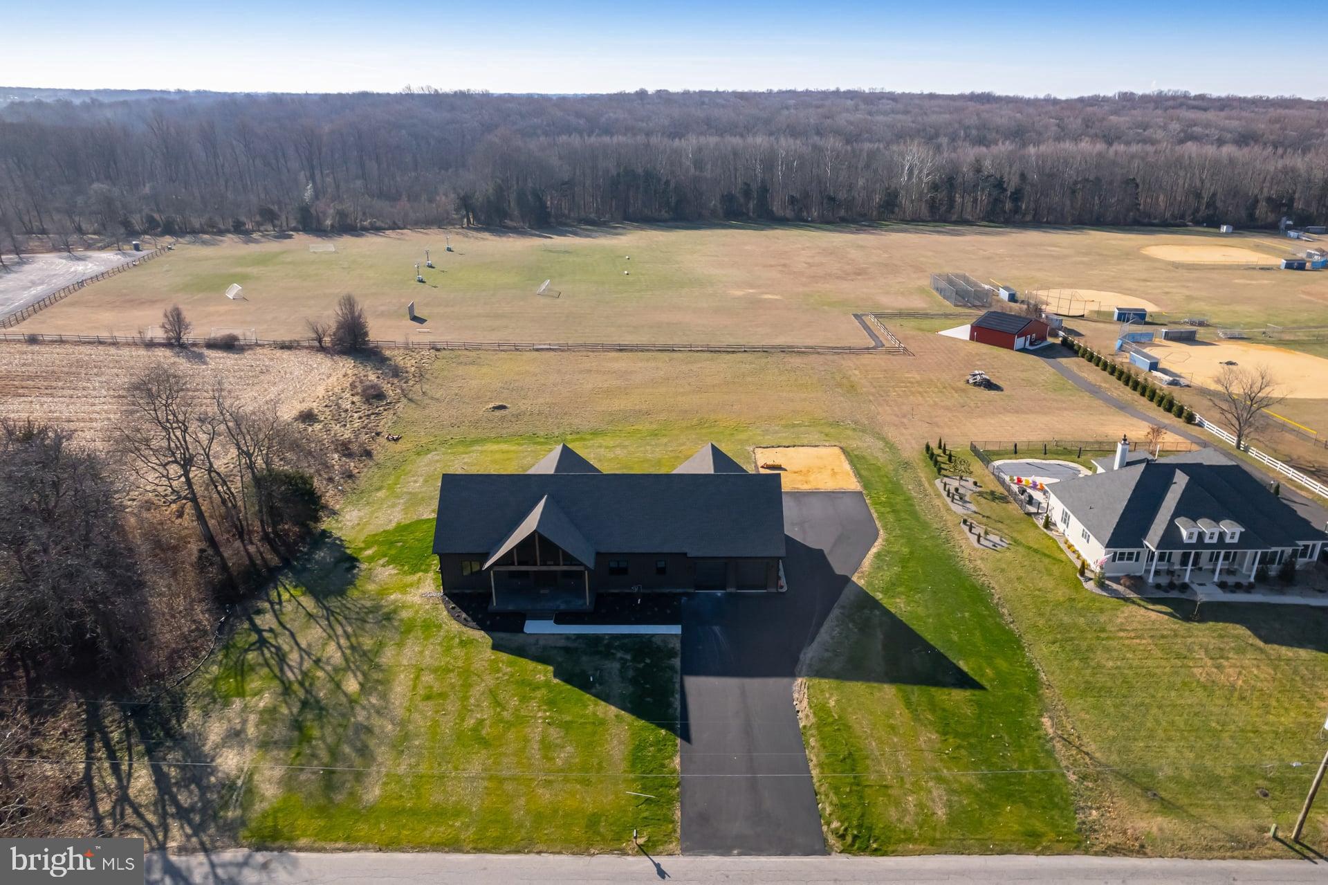 75 Ferrell Road Mullica Hill, NJ 08062 - Photo 39 of 42 a view of a swimming pool with a yard