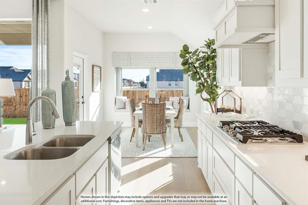 5845 Anning Way Pilot Point, TX 76258 - Photo 12 of 39 a kitchen with a sink and chairs