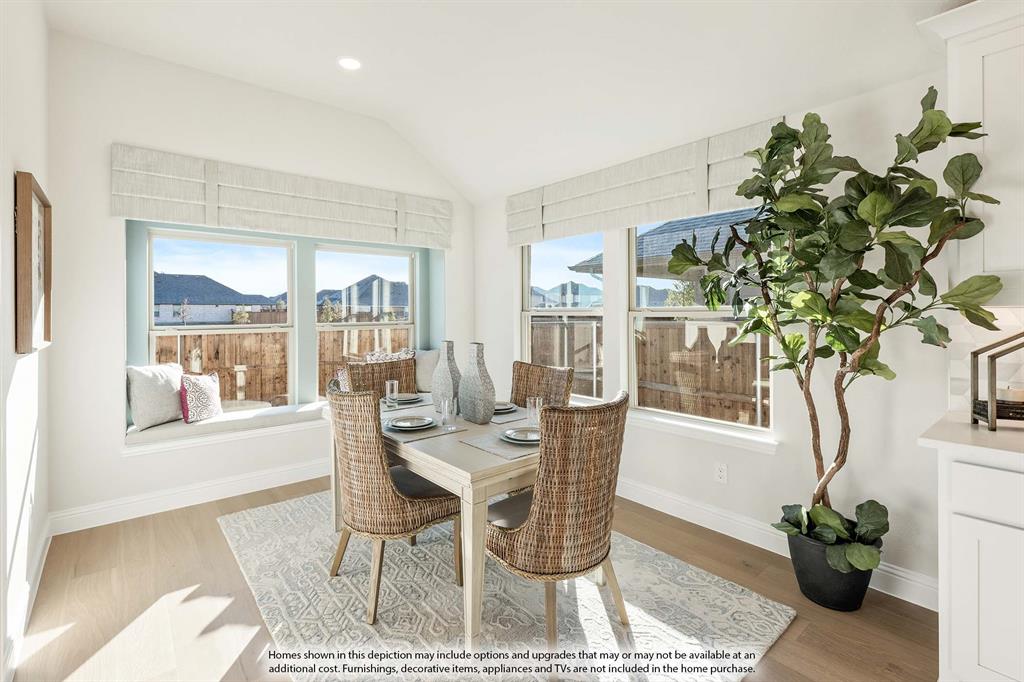 5845 Anning Way Pilot Point, TX 76258 - Photo 18 of 39 a dining room with furniture and wooden floor