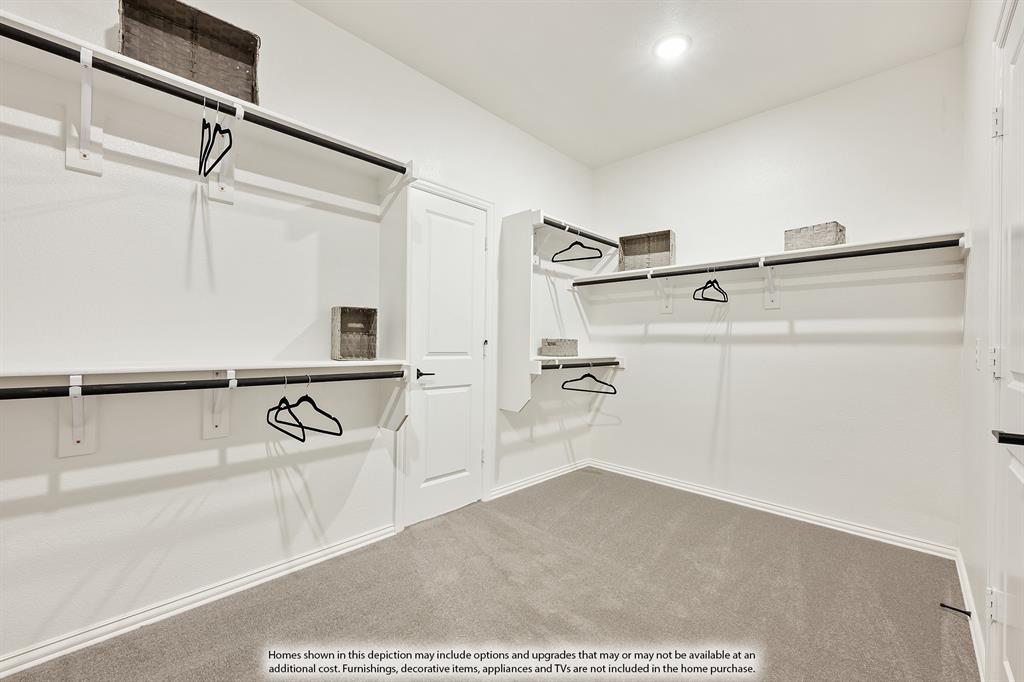 5845 Anning Way Pilot Point, TX 76258 - Photo 27 of 39 a view of a room with racks on the wall