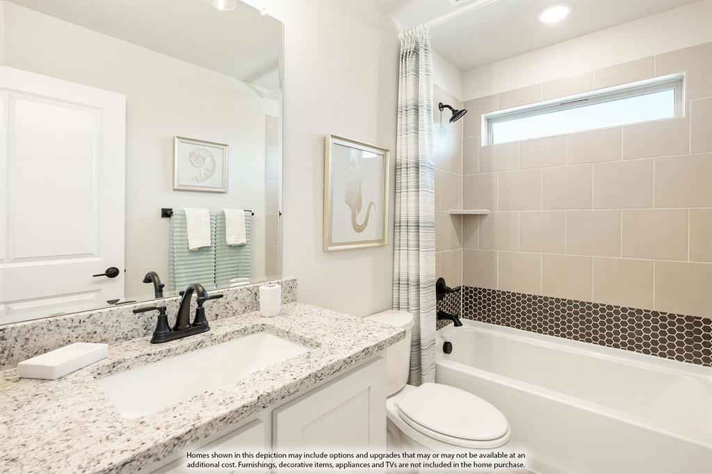 5845 Anning Way Pilot Point, TX 76258 - Photo 35 of 39 a bathroom with a granite countertop tub sink and a shower