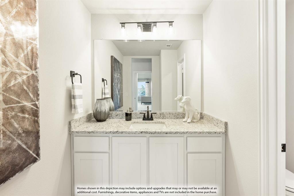 5845 Anning Way Pilot Point, TX 76258 - Photo 38 of 39 a bathroom with a sink and a mirror