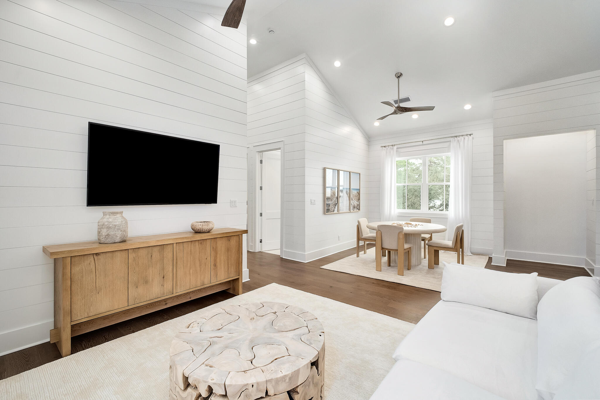 65 South Gulf Drive Santa Rosa Beach, FL 32459 - Photo 16 of 42 a living room with furniture and a flat screen tv