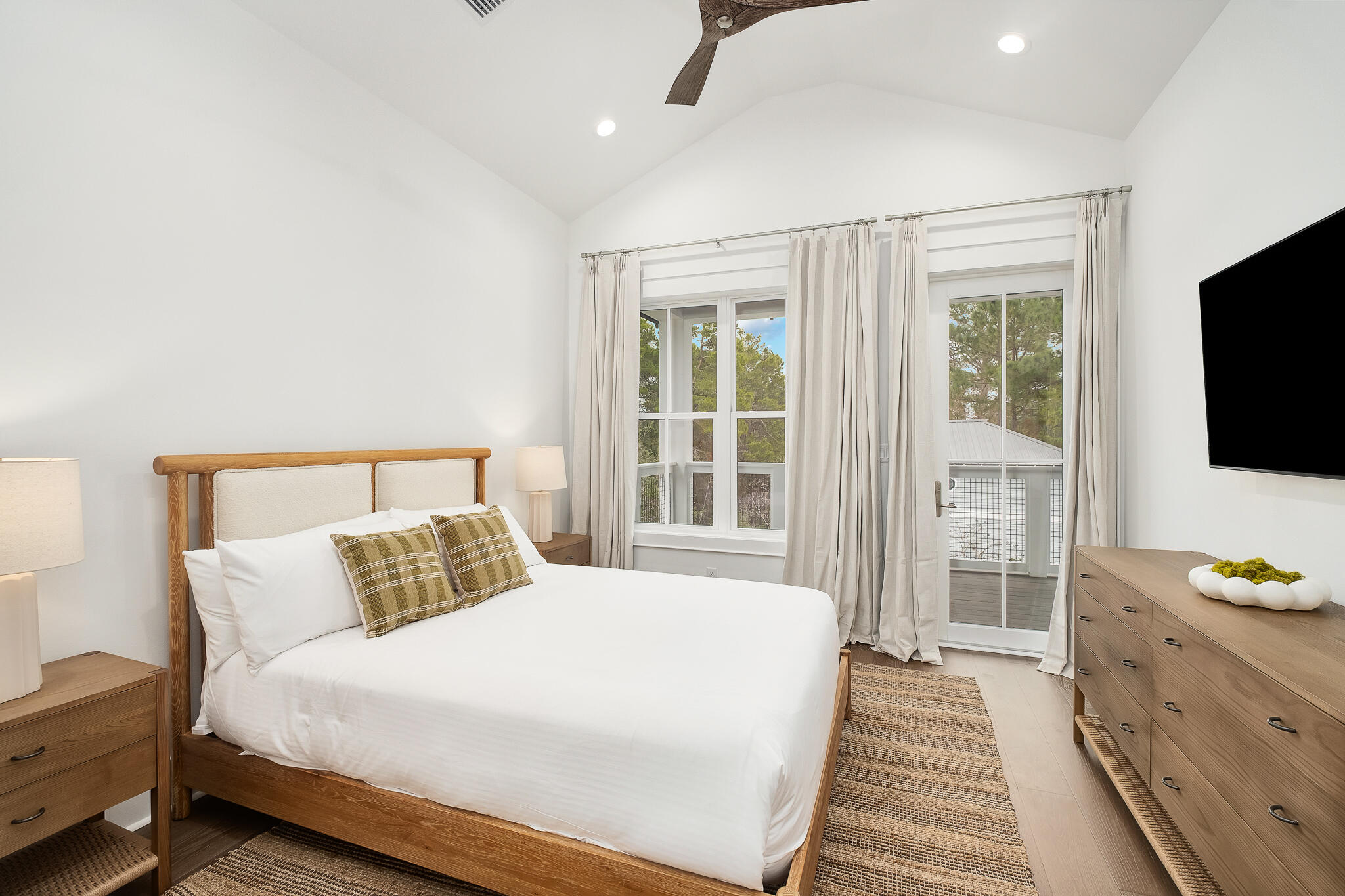 65 South Gulf Drive Santa Rosa Beach, FL 32459 - Photo 20 of 42 a bedroom with a bed and a flat tv screen on dresser