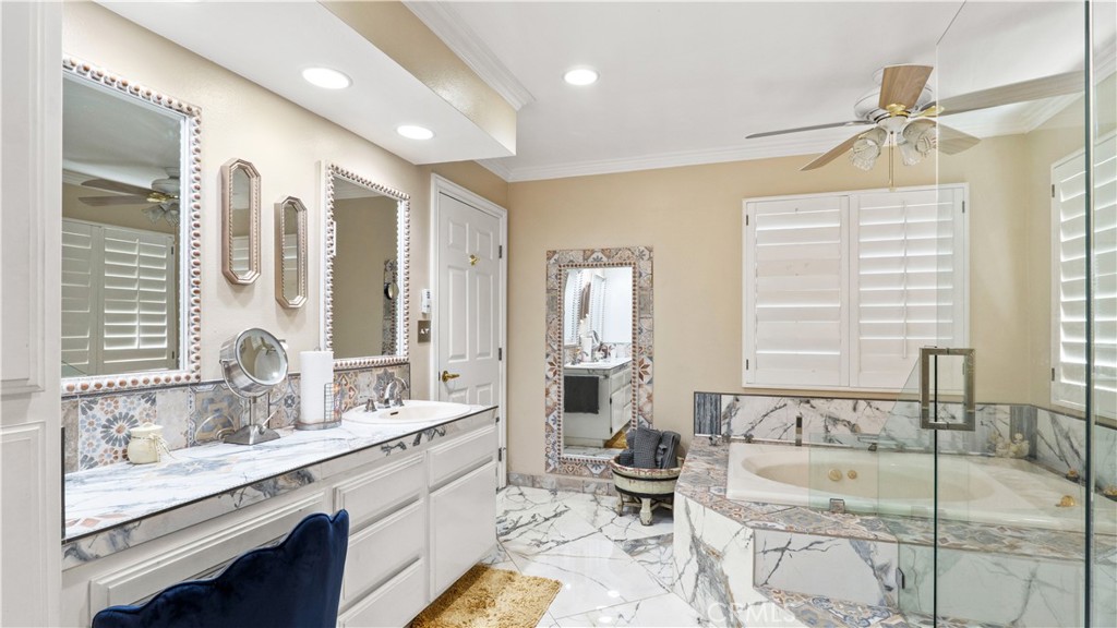 17850 Vista Del Lago Drive Riverside, CA 92503 - Photo 12 of 47 a spacious bathroom with sinks mirror and a bathtub