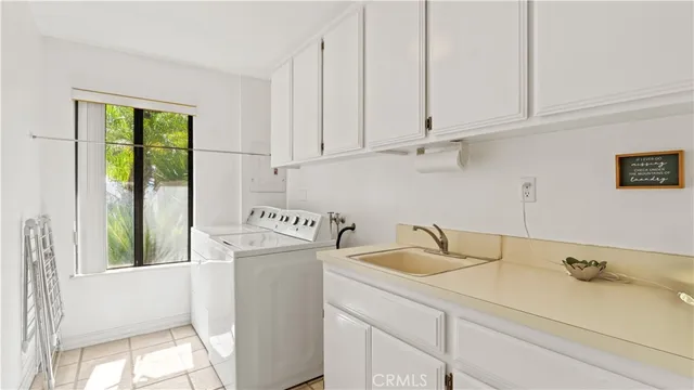 a bathroom with a sink a toilet and shower curtain