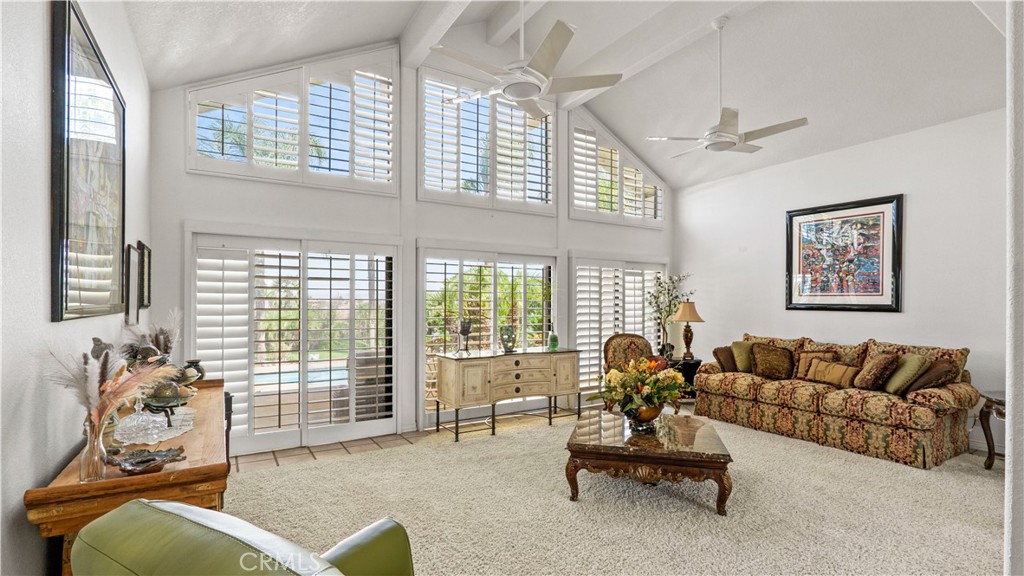 17850 Vista Del Lago Drive Riverside, CA 92503 - Photo 3 of 47 a living room with furniture and floor to ceiling windows
