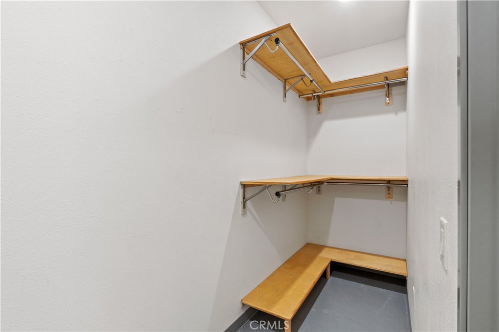 17850 Vista Del Lago Drive Riverside, CA 92503 - Photo 33 of 47 a view of room with racks on the wall