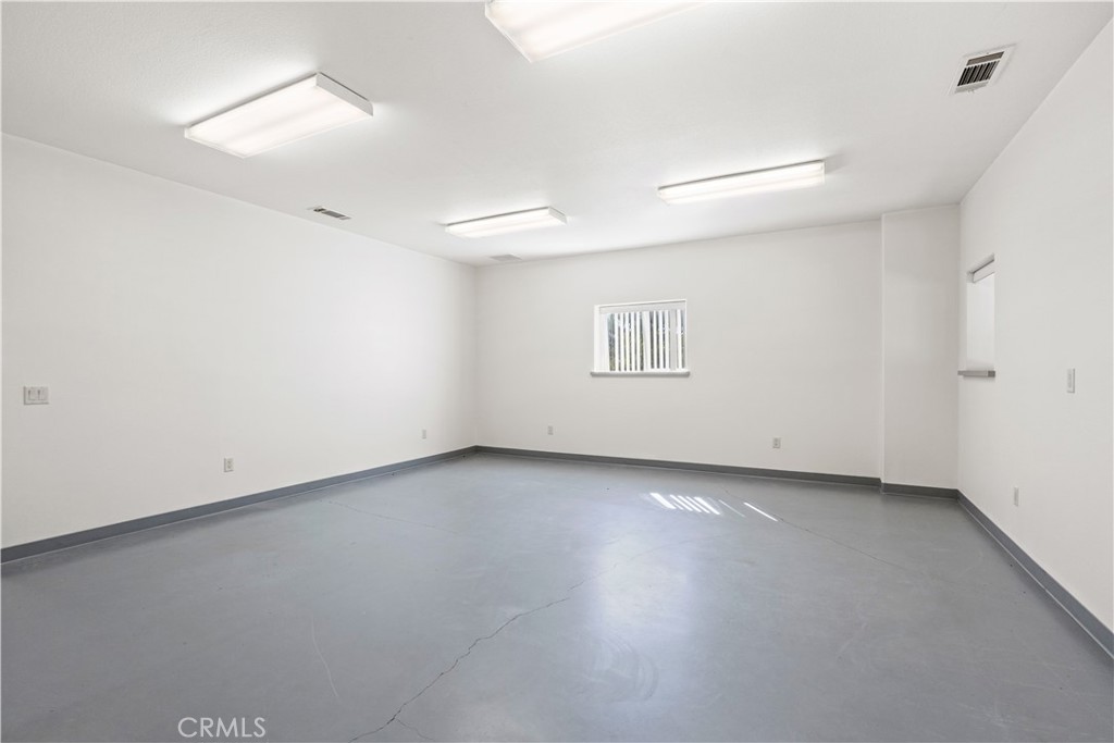 17850 Vista Del Lago Drive Riverside, CA 92503 - Photo 34 of 47 an empty room with a empty space and window