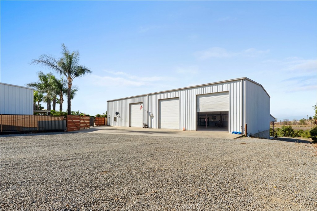 17850 Vista Del Lago Drive Riverside, CA 92503 - Photo 39 of 47 a view of a house with a yard and garage