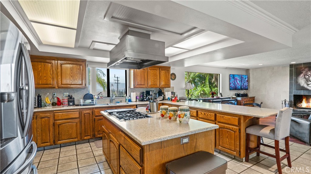 17850 Vista Del Lago Drive Riverside, CA 92503 - Photo 9 of 47 a kitchen with a sink a counter top space cabinets and stainless steel appliances