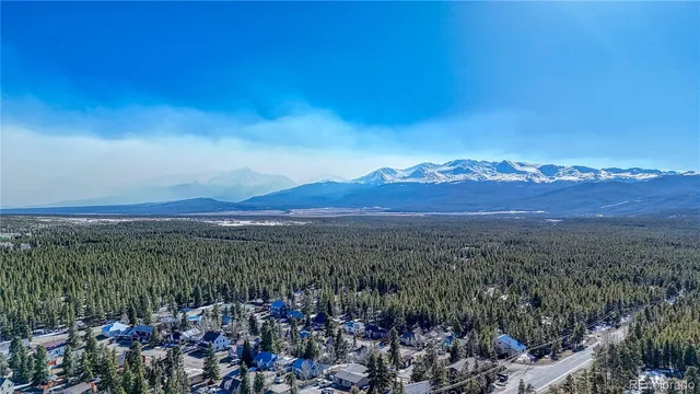 a view of a city with mountains in the background