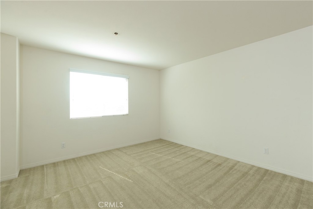4875 Prairie Run Road Eastvale, CA 91752 - Photo 12 of 18 an empty room with a window