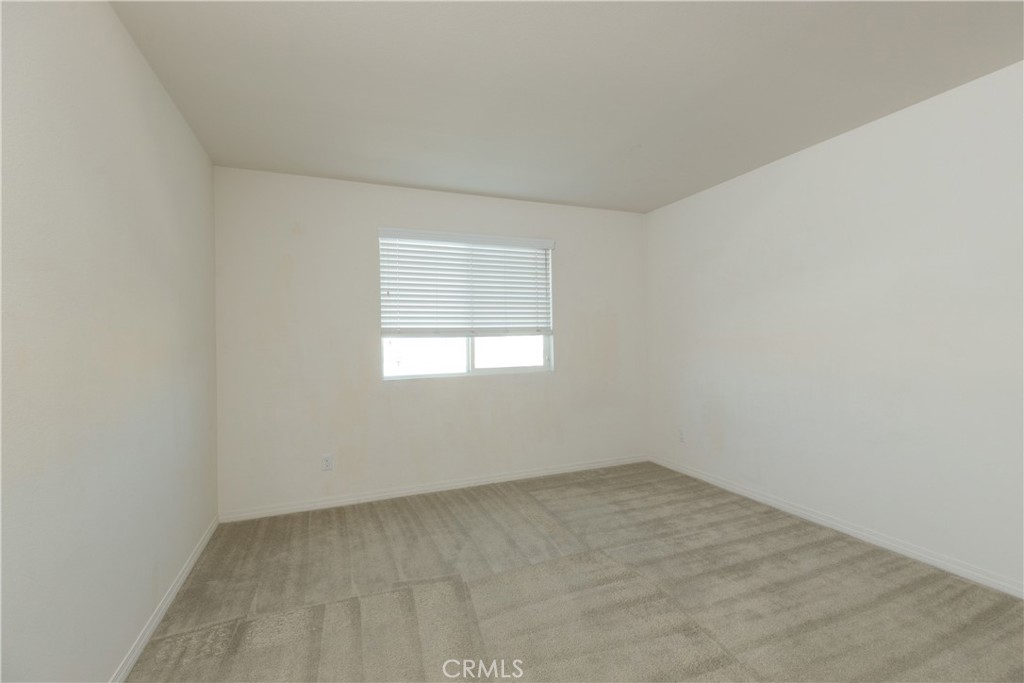 4875 Prairie Run Road Eastvale, CA 91752 - Photo 14 of 18 an empty room with a window