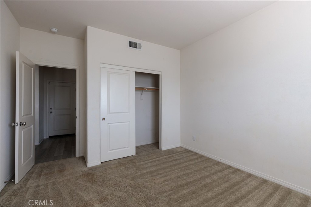 4875 Prairie Run Road Eastvale, CA 91752 - Photo 7 of 18 an empty room with closet