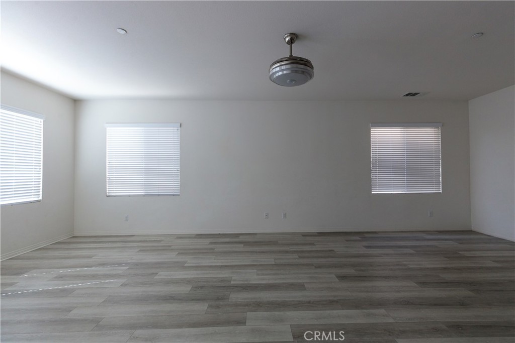 4875 Prairie Run Road Eastvale, CA 91752 - Photo 9 of 18 an empty room with a window