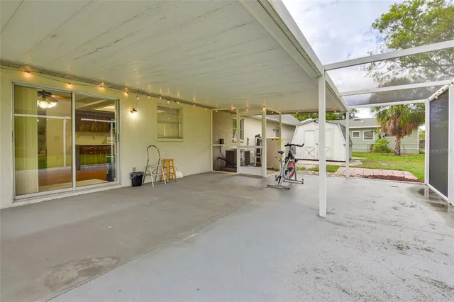 a view of a house with backyard and garden