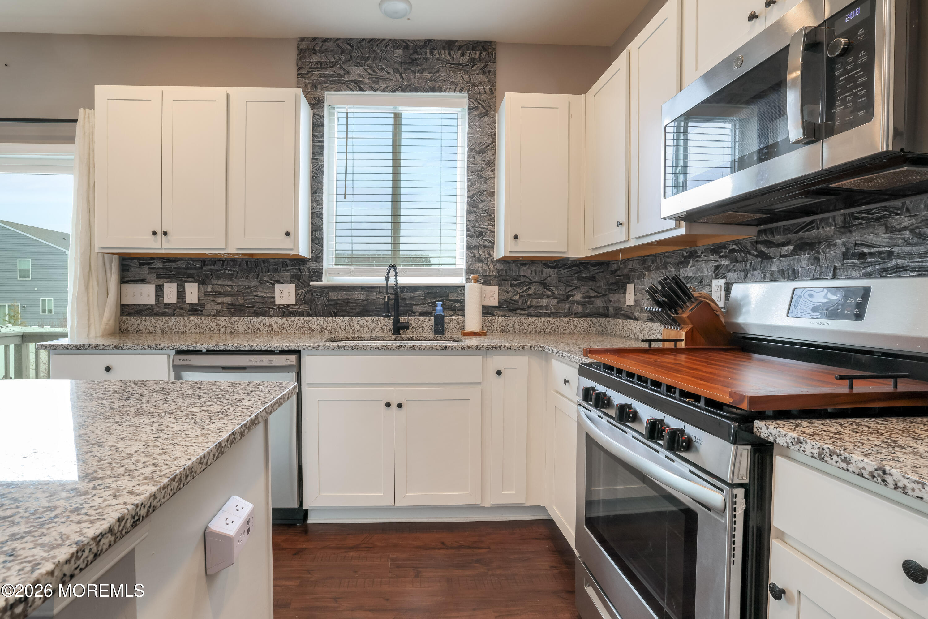 28 Dylan Boulevard Barnegat, NJ 08005 - Photo 12 of 51 a kitchen with stainless steel appliances granite countertop a sink stove and cabinets