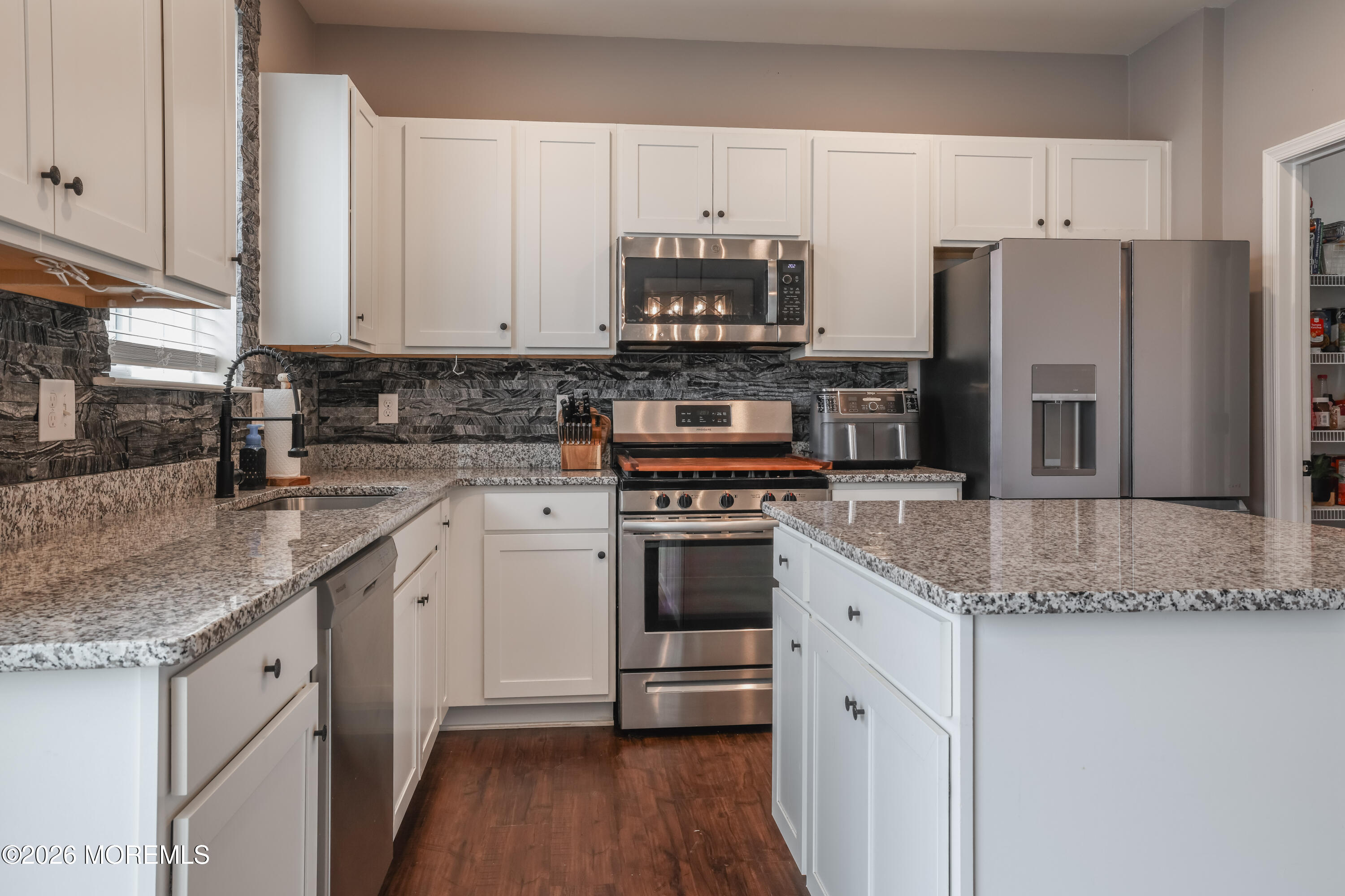 28 Dylan Boulevard Barnegat, NJ 08005 - Photo 13 of 51 a kitchen with stainless steel appliances granite countertop a sink stove and refrigerator