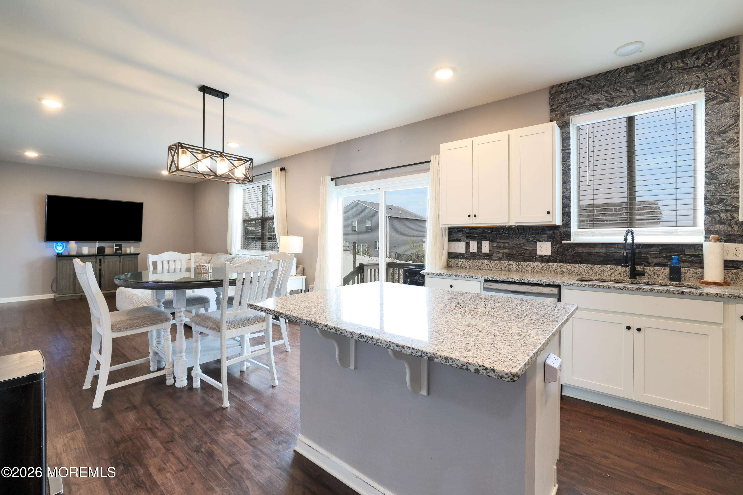 28 Dylan Boulevard Barnegat, NJ 08005 - Photo 16 of 51 a large kitchen with a table and chairs in it