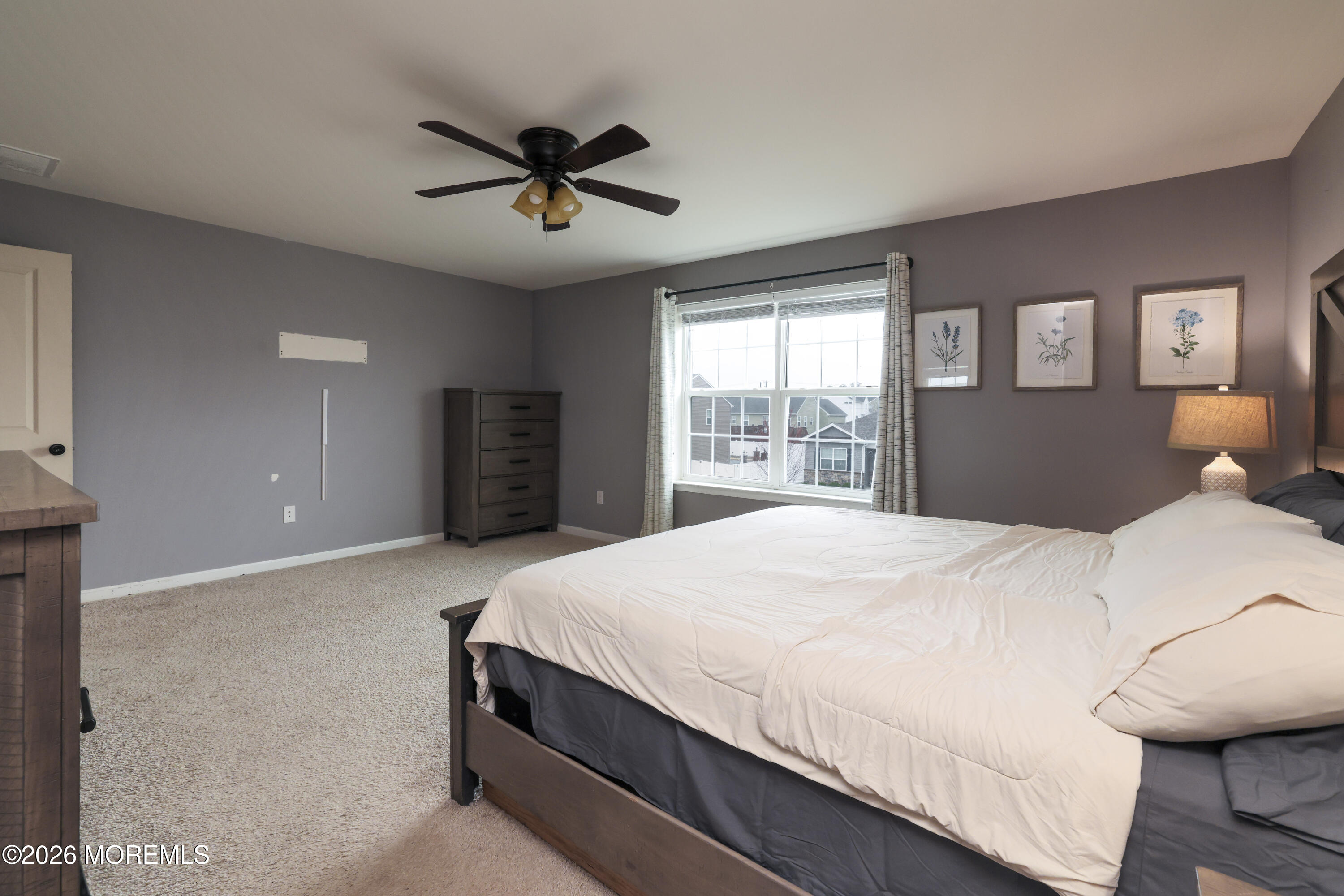 28 Dylan Boulevard Barnegat, NJ 08005 - Photo 27 of 51 a bedroom with a large bed and a chandelier