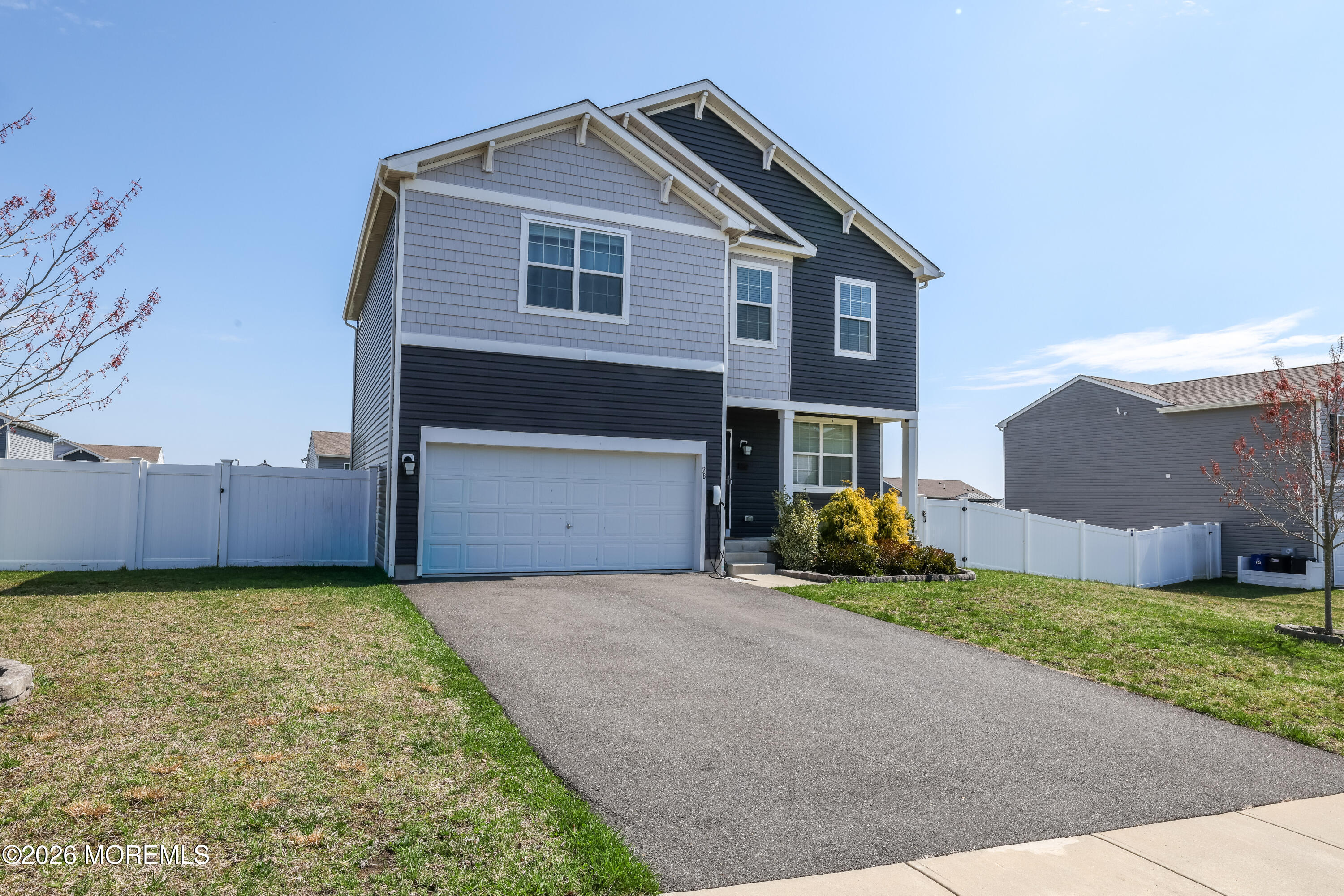 28 Dylan Boulevard Barnegat, NJ 08005 - Photo 3 of 51 a front view of a house with a yard and garage