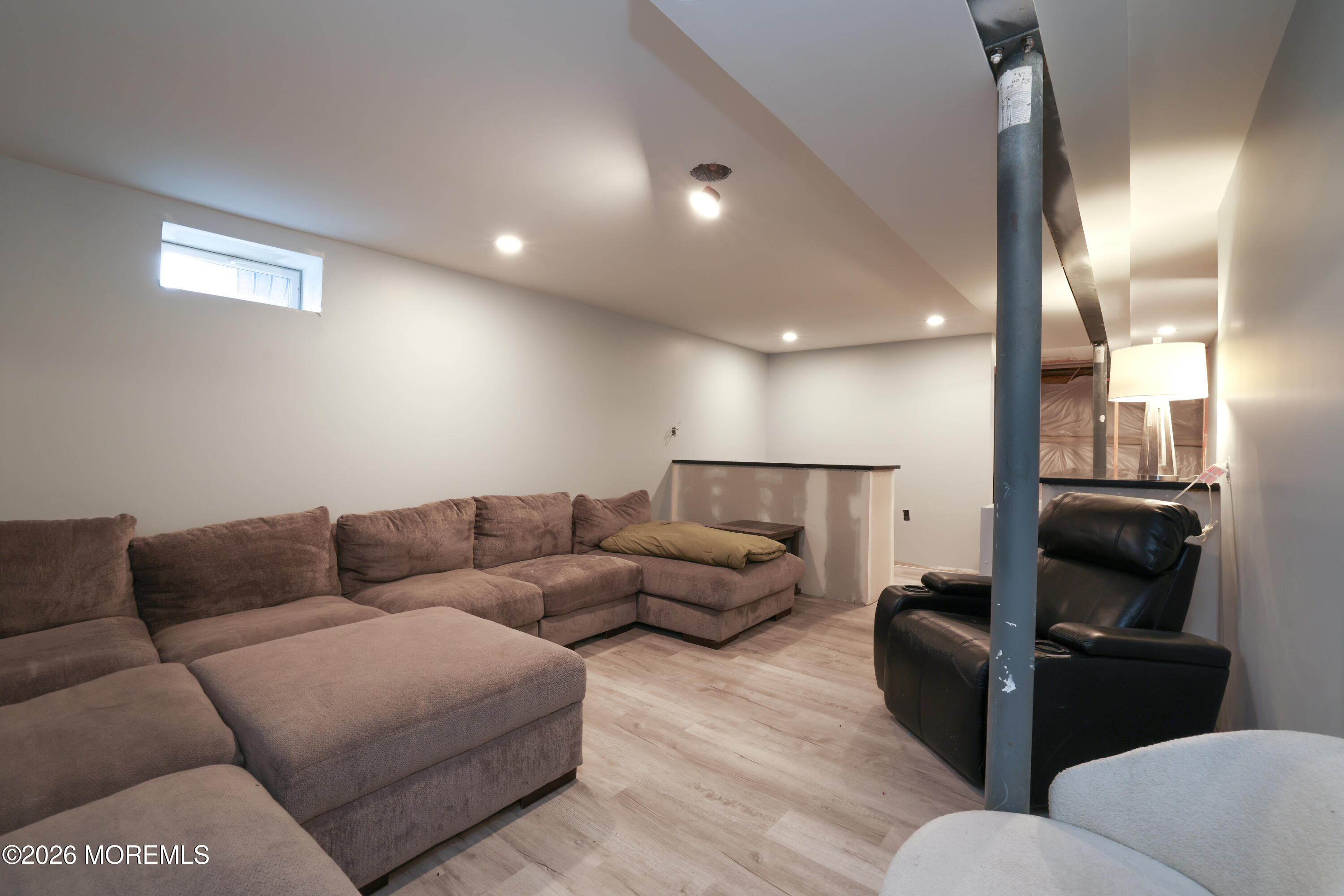 28 Dylan Boulevard Barnegat, NJ 08005 - Photo 44 of 51 a living room with furniture and a flat screen tv
