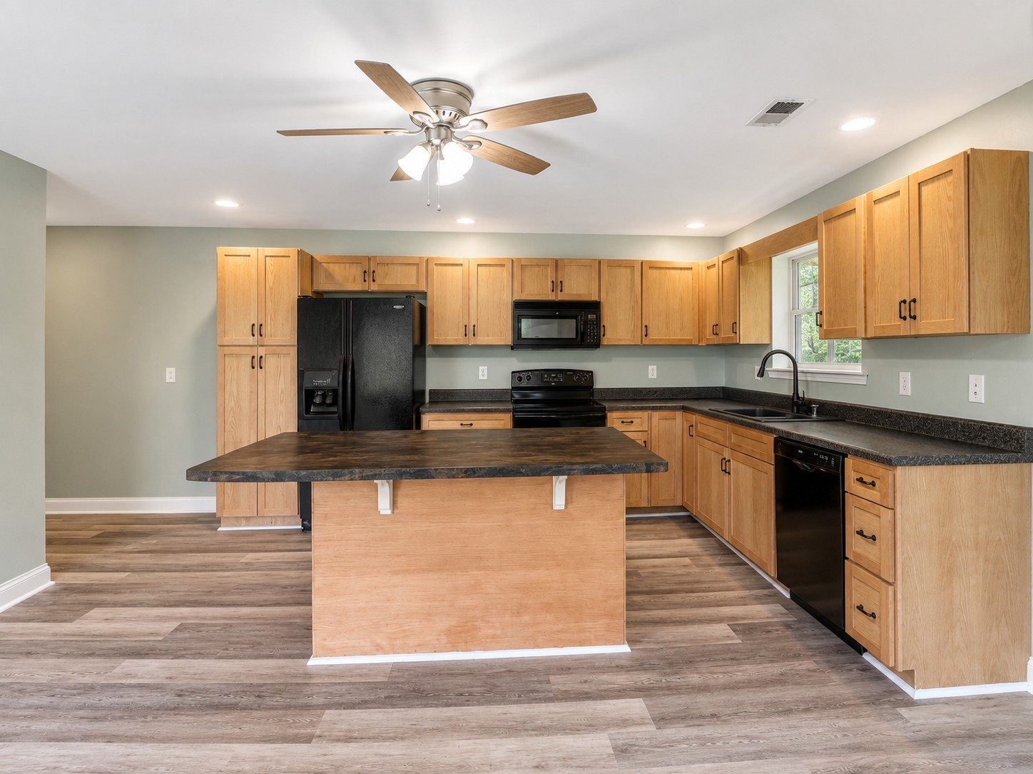 352 Main Street Cerulean, KY 42215 - Photo 8 of 32 a kitchen with stainless steel appliances granite countertop a sink a stove and cabinets