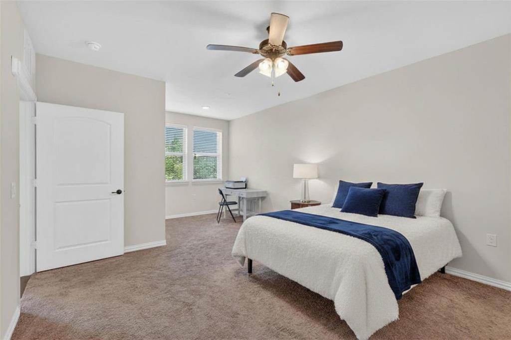 651 Watters Road, Unit 5305 Allen, TX 75013 - Photo 15 of 40 a bedroom with bed and window