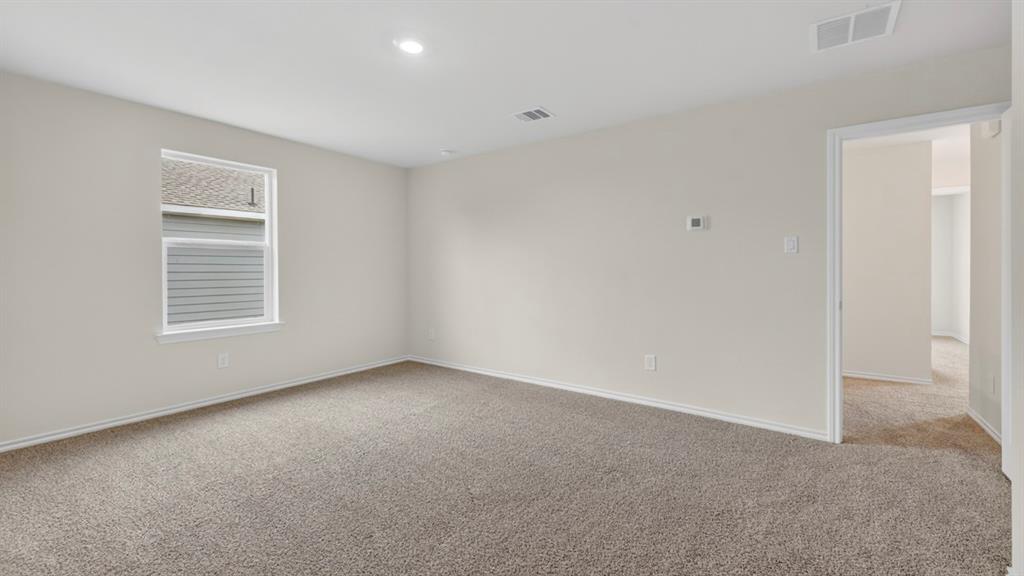 3534 Spring Time Street Forney, TX 75126 - Photo 13 of 24 Carpeted room with a single window and recessed lighting