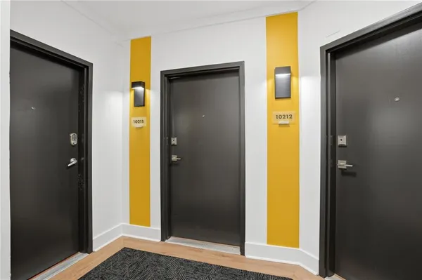 a view of a bathroom with a glass door and a door