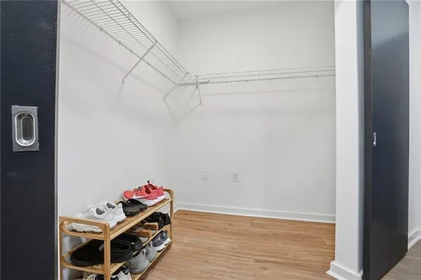 a view of a room with wooden floor