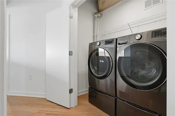a utility room with dryer and washer