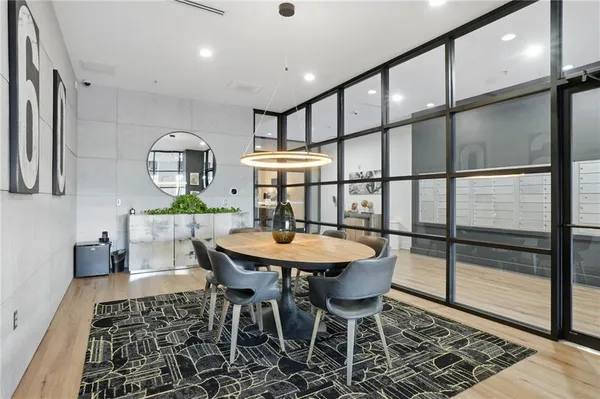 a dining room with furniture and a window