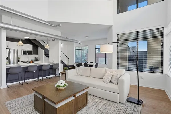 a living room with furniture and a table