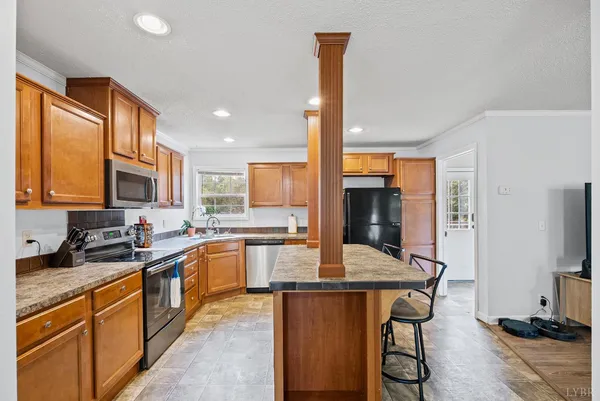 a kitchen with stainless steel appliances granite countertop counter space a sink and cabinets