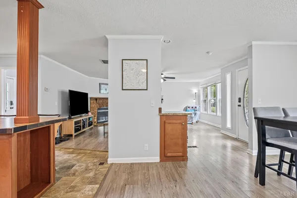 a view of a dining room with furniture and wooden floor