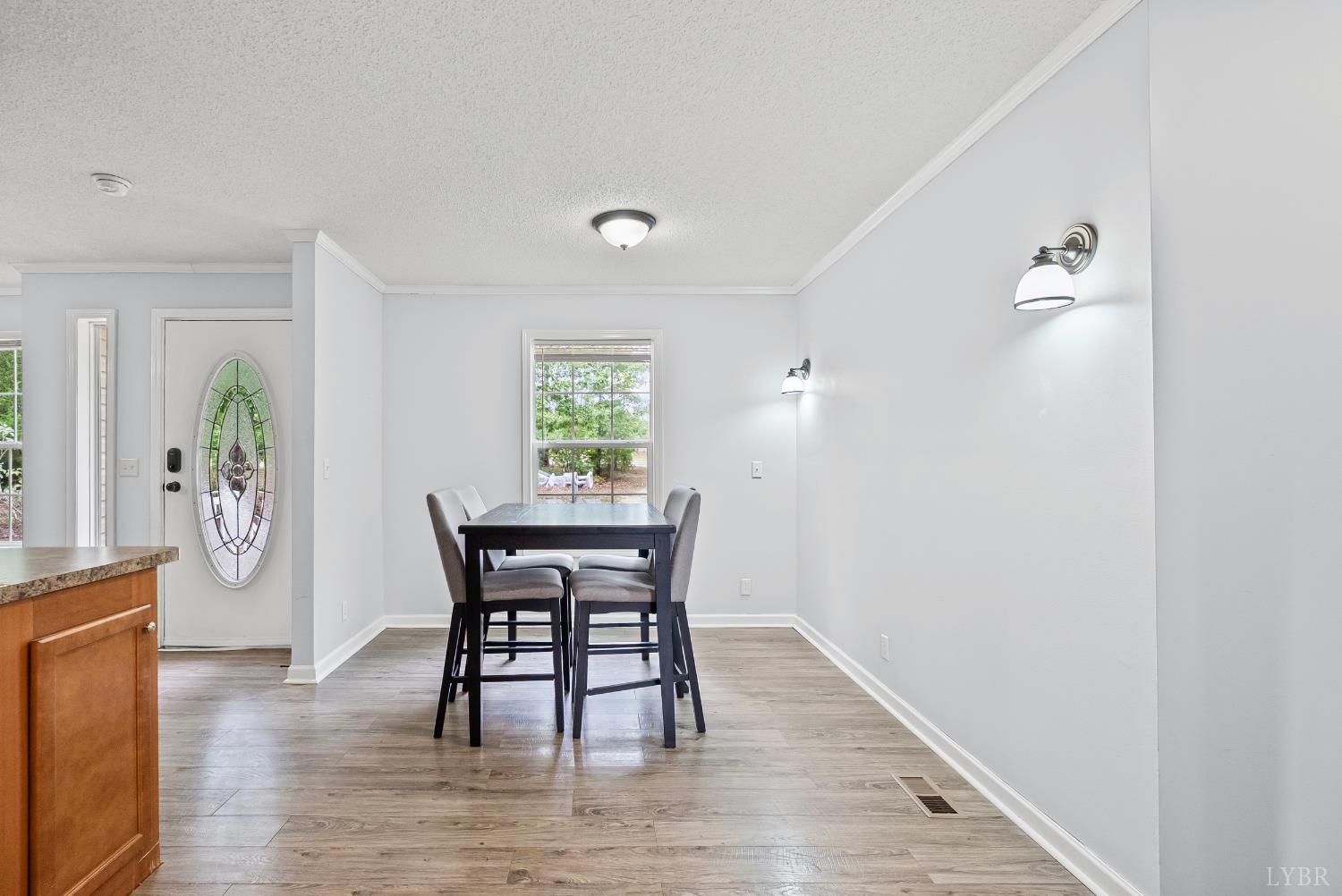 6124 Old Courthouse Road Appomattox, VA 24522 - Photo 16 of 52 a view of a dining room with furniture and wooden floor