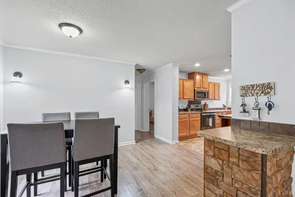 a bathroom with a granite countertop sink and a bathtub